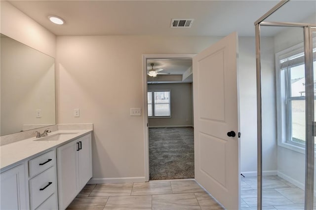 bathroom featuring vanity and ceiling fan