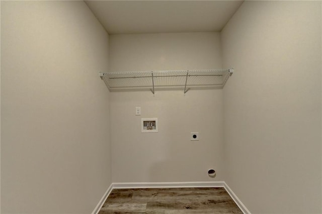 laundry area featuring electric dryer hookup, washer hookup, and hardwood / wood-style floors