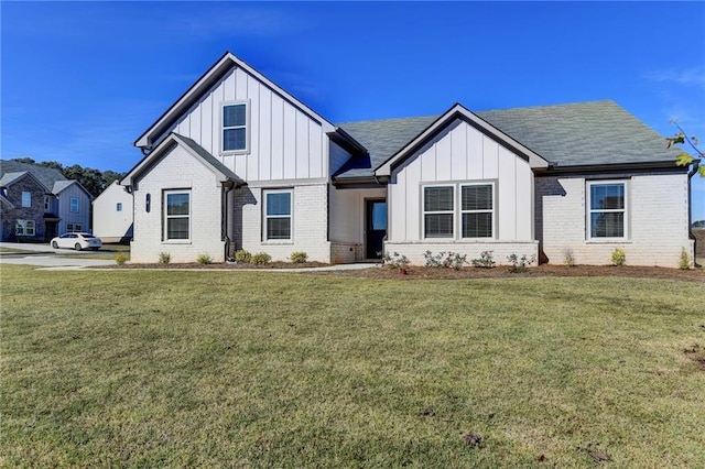 modern farmhouse with a front lawn