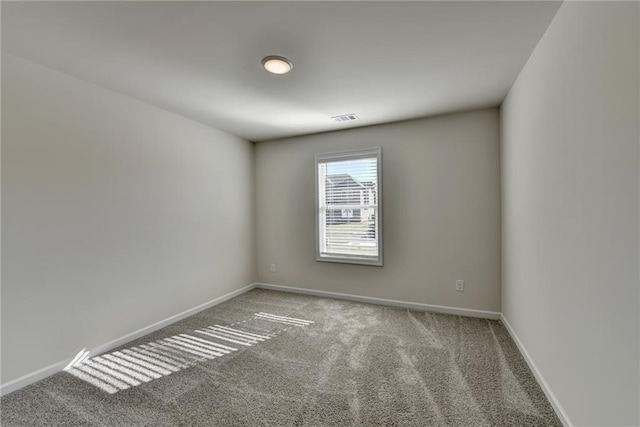 empty room featuring carpet floors