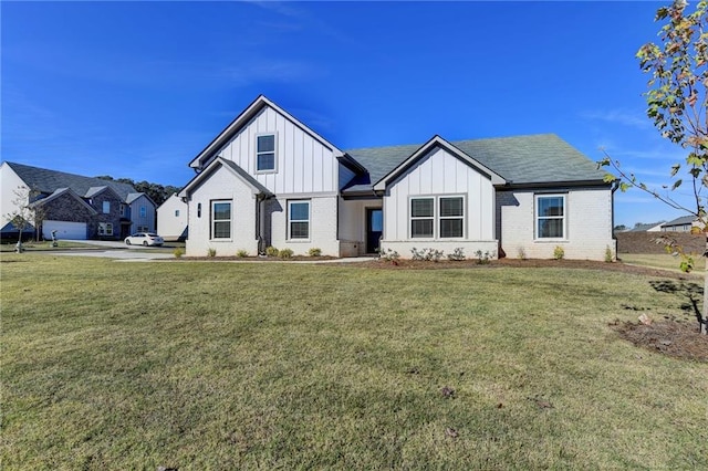 modern farmhouse with a front lawn