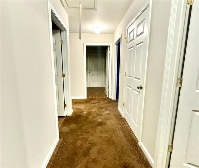 hallway with dark carpet