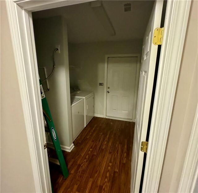 washroom with washer and clothes dryer and dark hardwood / wood-style floors