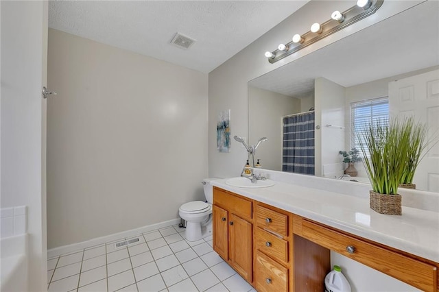 bathroom with walk in shower, tile patterned flooring, a textured ceiling, toilet, and vanity