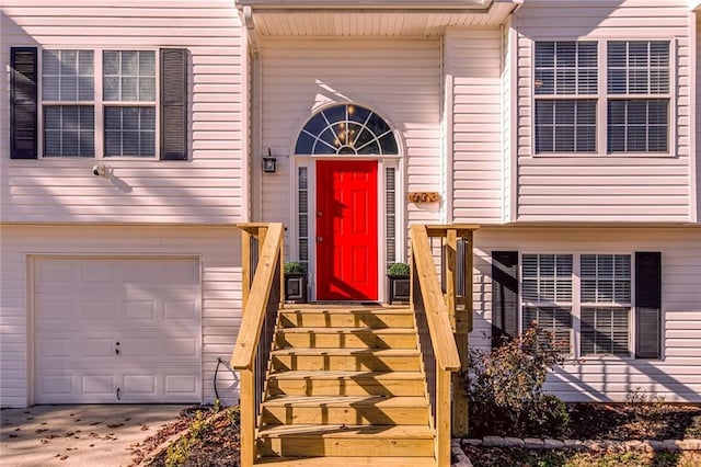 view of exterior entry featuring a garage