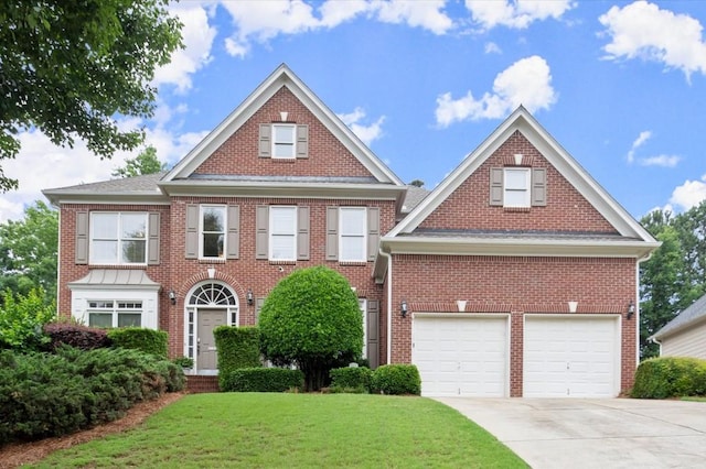 4108 Wyndam Hill Dr, Suwanee, GA 30024 - colonial house featuring driveway, a front yard, brick siding, and an attached garage