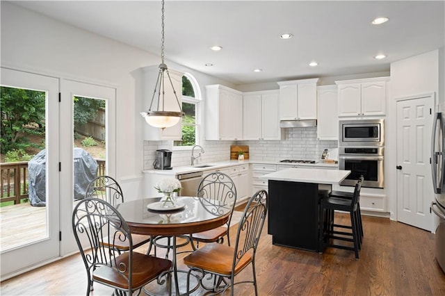 4108 Wyndam Hill Dr, Suwanee, GA 30024 - kitchen featuring stainless steel appliances, white cabinets, backsplash, and recessed lighting