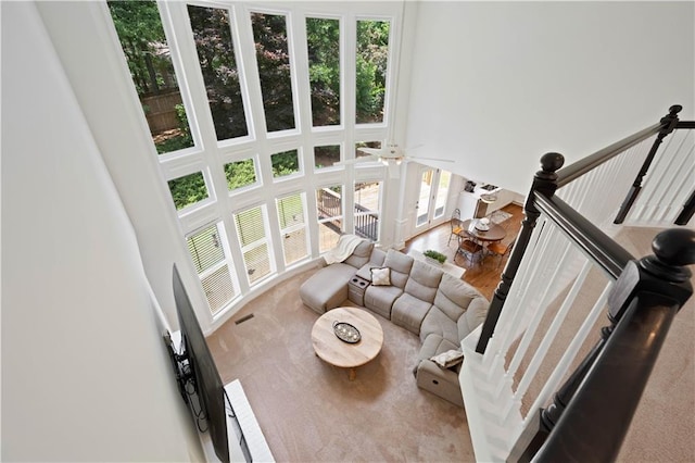 4108 Wyndam Hill Dr, Suwanee, GA 30024 - living room featuring a towering ceiling, healthy amount of natural light, and a ceiling fan