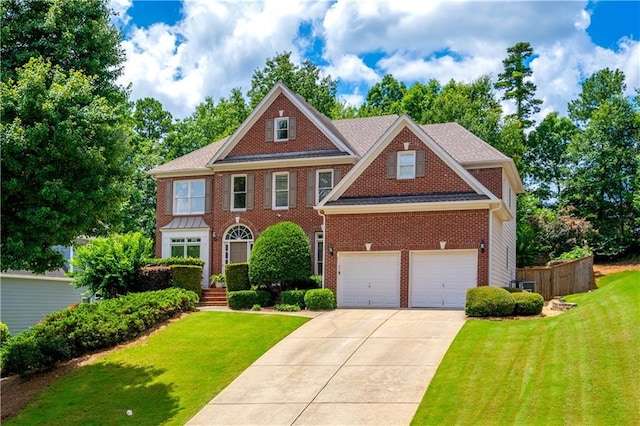4108 Wyndam Hill Dr, Suwanee, GA 30024 - colonial-style house featuring driveway, a front yard, brick siding, and an attached garage