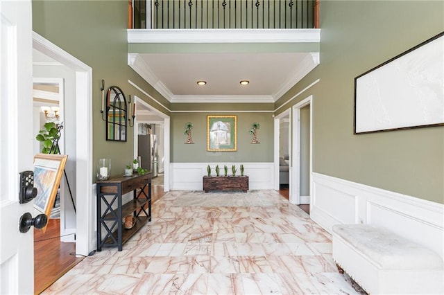 entryway featuring crown molding