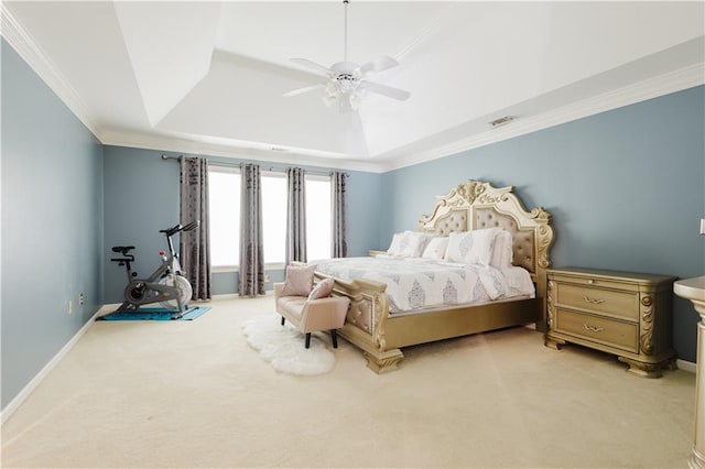 bedroom featuring baseboards, a raised ceiling, carpet flooring, and crown molding