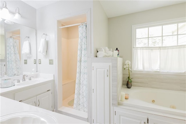 full bath featuring a shower with shower curtain, a tub with jets, and vanity