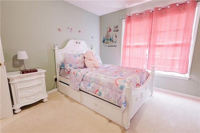 bedroom with carpet floors and baseboards