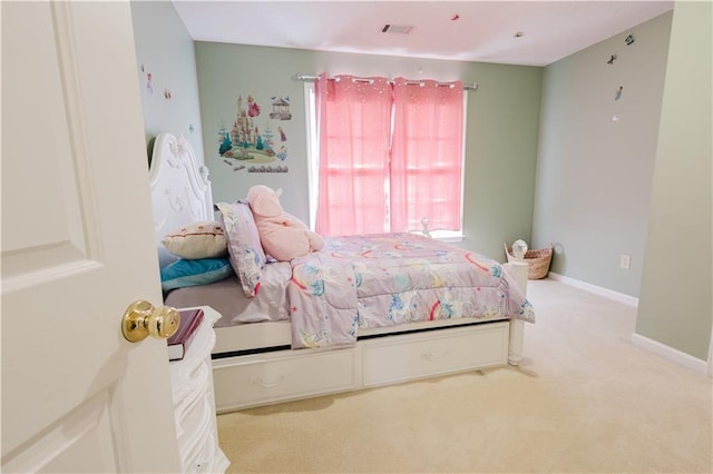 bedroom with carpet, visible vents, and baseboards