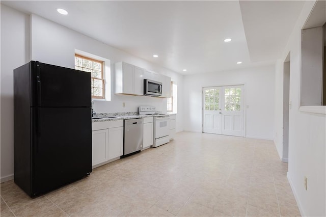 kitchen featuring a healthy amount of sunlight, appliances with stainless steel finishes, and recessed lighting