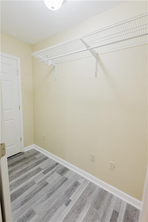 spacious closet with light wood-style floors