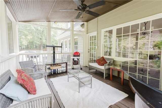 sunroom with a ceiling fan, lofted ceiling, and wooden ceiling