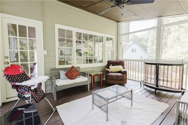 sunroom with a ceiling fan