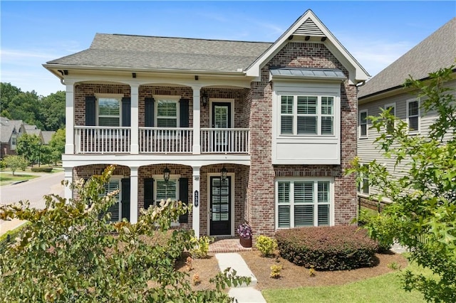 view of front of home featuring a porch and a balcony