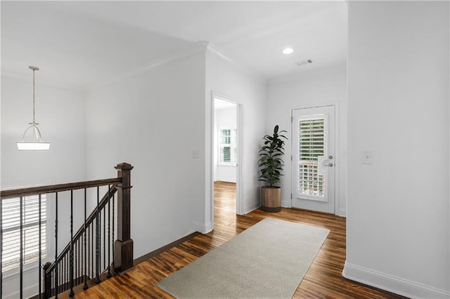 corridor with hardwood / wood-style floors