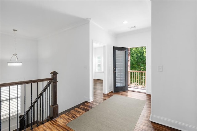 hallway featuring dark hardwood / wood-style flooring and ornamental molding