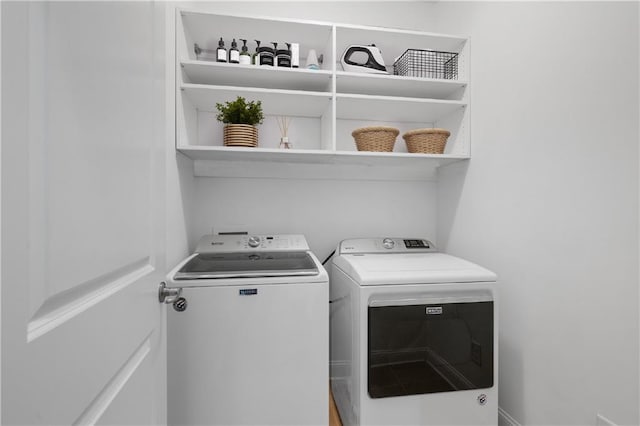 laundry room featuring separate washer and dryer