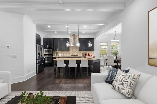 living room featuring ornamental molding, dark wood-type flooring, and beam ceiling