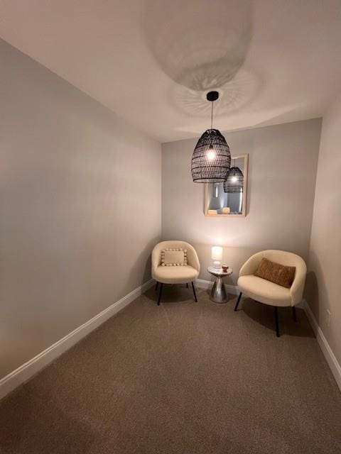 unfurnished room with carpet and baseboards