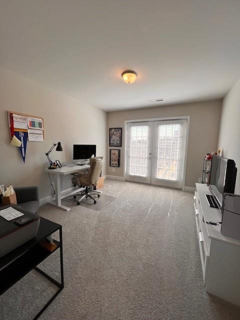 office with french doors, carpet flooring, and baseboards