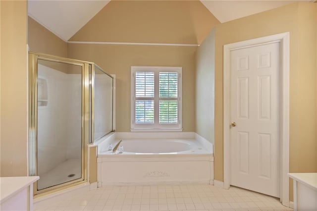 bathroom featuring vanity, lofted ceiling, and independent shower and bath