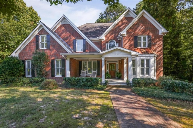 craftsman-style house with a porch and a front yard