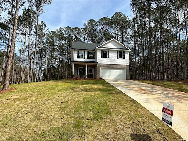 traditional-style home with an attached garage, a front lawn, concrete driveway, and brick siding