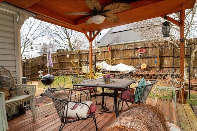 deck featuring a grill and ceiling fan