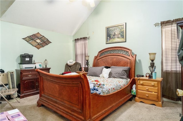 carpeted bedroom featuring lofted ceiling and ceiling fan