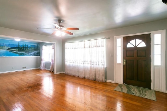 foyer featuring hardwood / wood-style flooring and ceiling fan