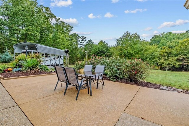 view of patio / terrace featuring a carport