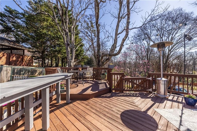 deck with outdoor dining area