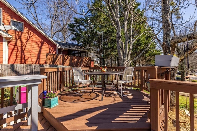 wooden deck with outdoor dining area