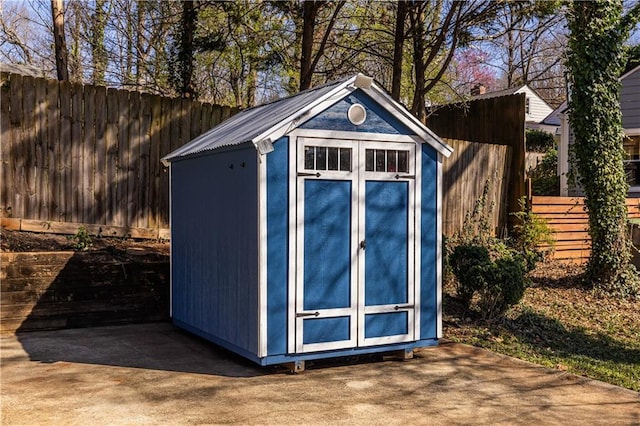 view of shed featuring a fenced backyard