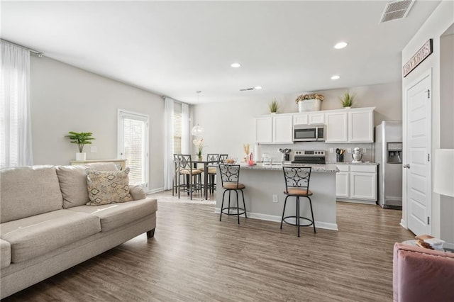 living room with dark wood-type flooring