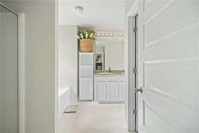 bathroom featuring vanity and plus walk in shower