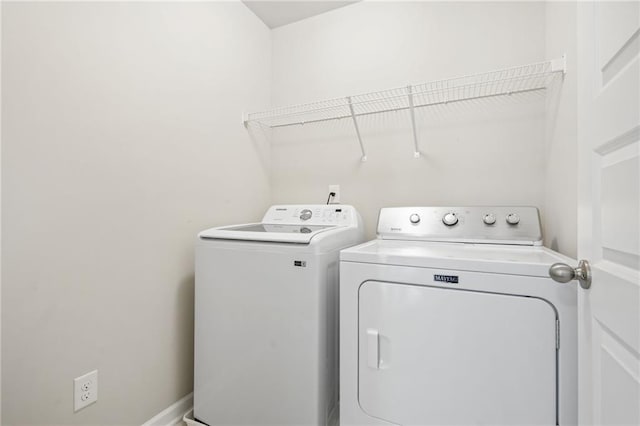 laundry room with independent washer and dryer