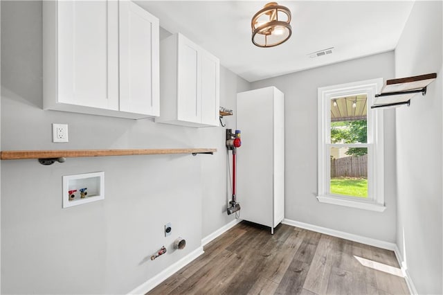 615 Rosedown Way, Alpharetta, GA 30022 - laundry area featuring electric dryer hookup, wood finished floors, cabinet space, and washer hookup