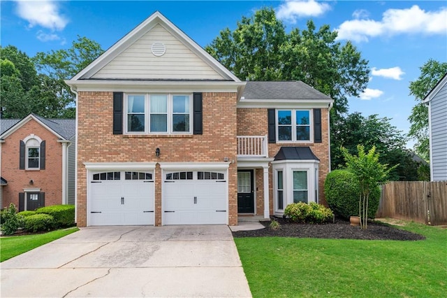 615 Rosedown Way, Alpharetta, GA 30022 - view of front of property featuring a balcony, concrete driveway, brick siding, and a garage