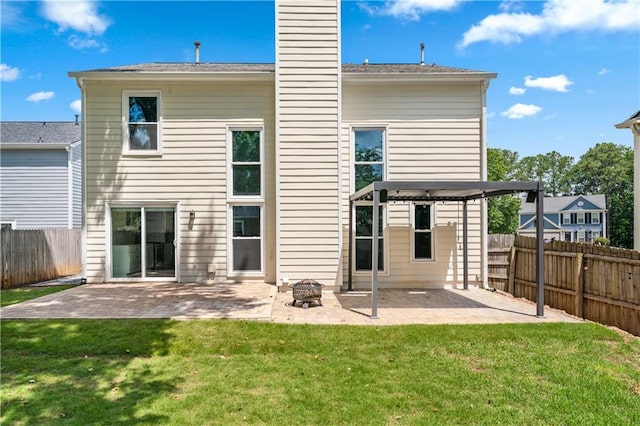615 Rosedown Way, Alpharetta, GA 30022 - rear view of property with a patio, a fenced backyard, a chimney, and an outdoor fire pit