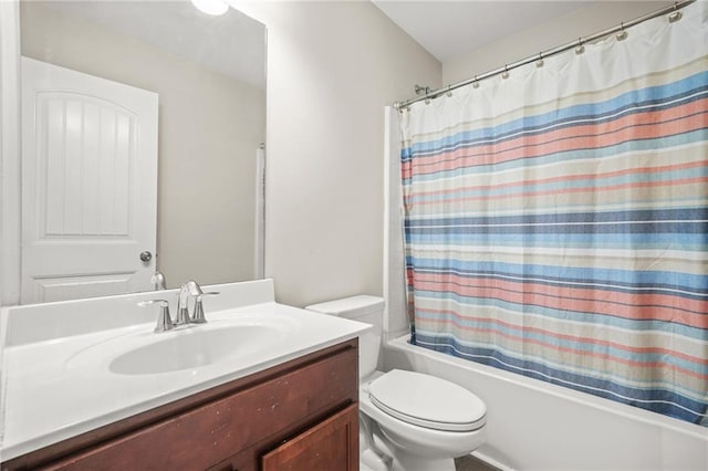 bathroom with toilet, shower / bath combo, and vanity