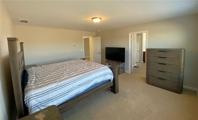 bedroom featuring light colored carpet