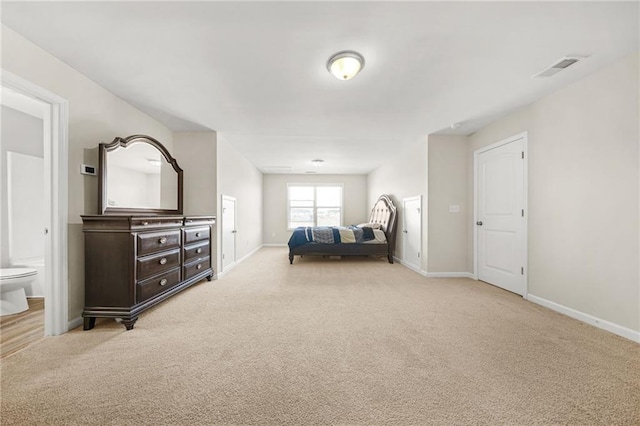 bedroom featuring carpet flooring, visible vents, and baseboards