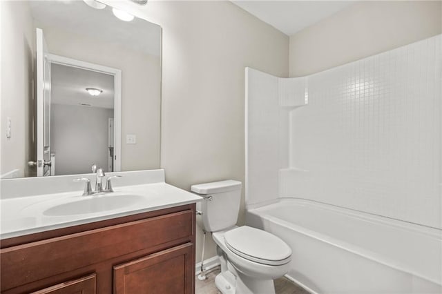 bathroom featuring shower / washtub combination, vanity, and toilet
