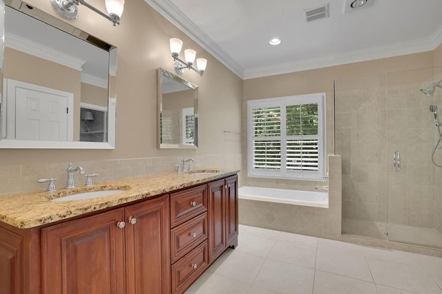 full bathroom with visible vents, a sink, a bath, and a stall shower